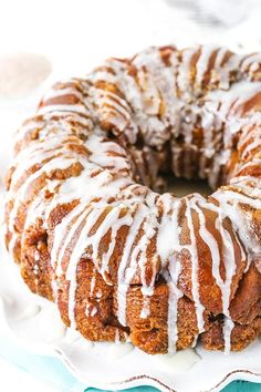 a bundt cake with white icing on a plate