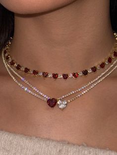 As seen on The TODAY Show! This bestselling bling bling beauty is made with premium-quality heart-shaped crystal and 925 Sterling Silver, the Gumdrop Necklace is 18K plated and hypoallergenic. Now available in: Deep Red (gold plated) White (gold plated) Ocean Blue (gold plated) Baby Pink (gold plated) Icy White (rhodium plated silver) Pitch Black (gold plated) Measures at about 16" long, with an 1" long adjustable gold clasp closure. Dope Jewelry Accessories, Jewelry Accessories Ideas, Heart To Heart, Dope Jewelry, Classy Jewelry, Expensive Jewelry, Tennis Necklace, Jewelry Lookbook, Fancy Jewelry