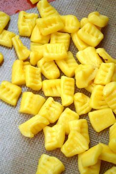 cut up pieces of pineapple sitting on top of a table