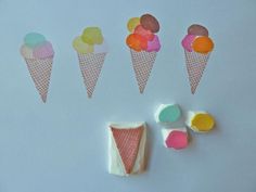 some ice cream cones and candy on a blue background with other items to make it look like they are made out of paper