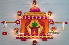 an intricately decorated diya with lights and decorations on the wall in front of it