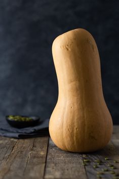 a squash sitting on top of a wooden table