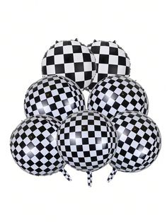 black and white checkered balloons are arranged together