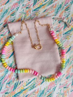 Indulge in some sweet summertime vibes with our Summer Candy Necklace. Handmade with colorful and bright beads, this necklace is the perfect accessory to add a touch of sunshine to any outfit. Plus, it's made with gold-filled materials for a bright and luxurious finish. Get ready to make a statement with this playful a Gold Beaded Necklaces With Colorful Beads For Everyday, Trendy Colorful Beads Chain Necklace Gift, Summer Necklace With Adjustable Chain And Round Beads, Trendy Colorful Beaded Chain Necklace As Gift, Handmade Colorful Necklaces For Vacation, Pink Necklaces With Colorful Beads For Vacation, Pink Necklace With Colorful Beads For Vacation, Trendy Gold Beaded Necklaces With Lobster Clasp, Trendy Gold Beaded Necklace With Lobster Clasp