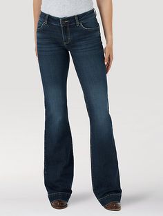 THE TROUSER: THE ULTIMATE IN WOMEN'S RETRO® JEANS Like all Wrangler Retro® jeans, our Mae wide-leg trouser jean is marked by its Western authenticity, making it a go-to style for cowgirls everywhere. With its contour waist and mid-rise fit, these women's trouser jeans are made to fit comfortably while they flatter all your curves. With more room at the knee and a gradual opening down the leg, the Mae wide-leg trouser gives you the room you need to stay active and in style. Surprise Dance Outfits, Womens Trouser Jeans, Jean Fits, Retro Jeans, Dark Wash Denim, Trouser Jeans, Dance Outfits, Wide Leg Trousers, Wide Leg Jeans