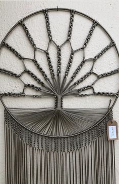 a metal wall hanging on the side of a building