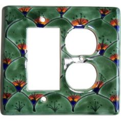 a decorative light switch plate cover with flowers on green and orange tiles in the shape of a flower