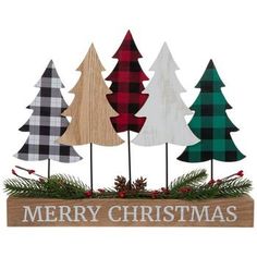 three wooden christmas trees with the words merry christmas