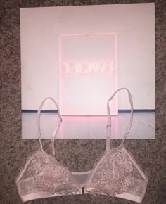 two bras sitting next to each other on the floor