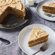 a piece of cake on a plate with a fork next to it and a glass of milk