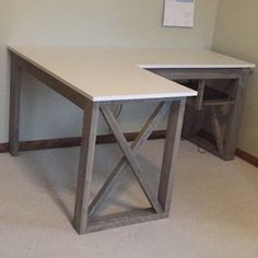 a white desk with a wooden cross leg