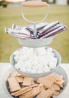 three tiered trays filled with marshmallows and crackers