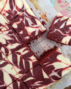 red velvet cake with white frosting cut into squares