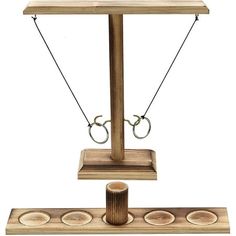 a wooden balance scale with two rings on it