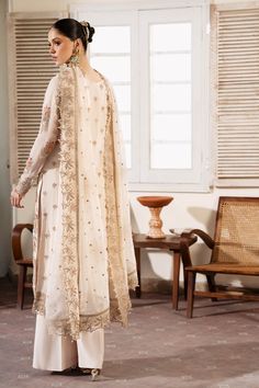 Brand: Serene PremiumProduct Code: S-1081 PerleCollection: Serene Premium Embroidered Muse Luxury Chiffon CollectionFabric: Chiffon DESIGN DETAILS: Embroidered & Hand Embellished Chiffon Front Embroidered Organza Front Open Border Embroidered Chiffon Back Embroidered Organza Front Back Border Embroidered Chiffon Sleeves Embroidered Organza Sleeves Border Embroidered Chiffon Dupatta Dyed Raw-silk Trousers DISCLAIMER:* Lining, Laces, and Tassels are not included in unstitched variants.* Embellishment items in stitched outfits are subject to market availability.* The actual colors of the outfit may vary from the colors being displayed on your device. CARE INSTRUCTIONS: Extra Fabric Has Been Used For Shoot Original Color May Vary Slightly From The Picture Dry Clean Recommended Iron The Clothes Batik Print Dress, Indian Anarkali, Lehenga Jewellery, Saree Sale, Chiffon Sleeves, Organza Sleeves, Lehenga Style, Lawn Dress, Chiffon Collection