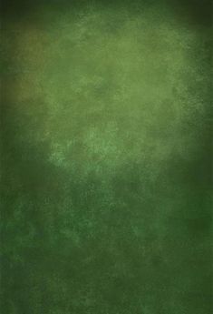 an abstract green background with some black spots