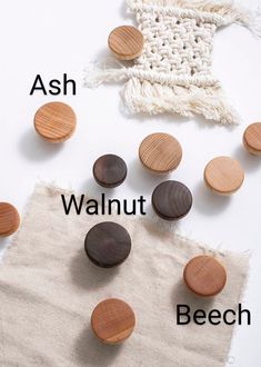 several wooden buttons sitting on top of a piece of cloth