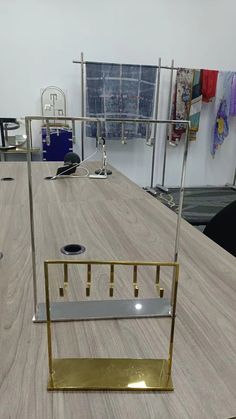 an empty table with some gold and silver items on it