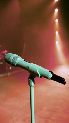 a microphone on a stand in front of some lights