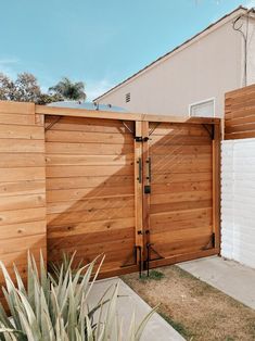 a wooden fence with two doors on each side