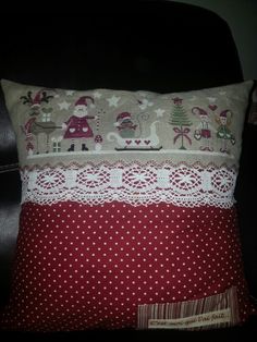 a pillow that has been made to look like it is decorated with christmas decorations and lace