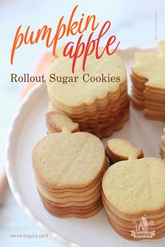 small heart shaped sugar cookies on a plate with the words pumpkin apple written above them