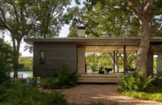 an image of a small house in the woods