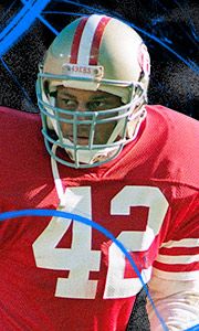 a close up of a football player wearing a uniform