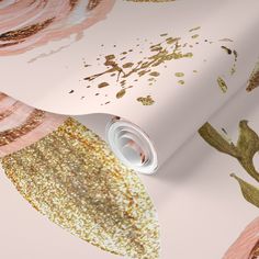 a pink wallpaper with gold glitters on it