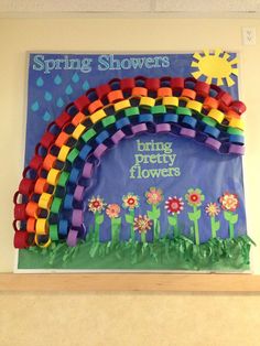 a poster with flowers and a rainbow on it