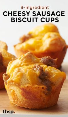 three cheesy sausage biscuit cups on a cutting board with the title 3 ingredient