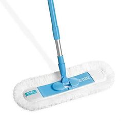 a blue and white mop on a white surface