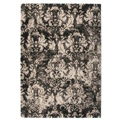 an area rug with black and white floral designs on it's sides, in the middle