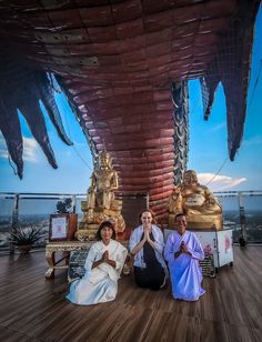 ladies at the top of a temple in thailand