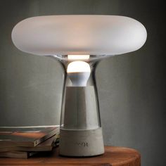 a table lamp sitting on top of a wooden table