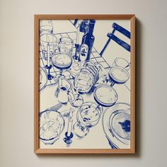 a blue and white drawing of dishes on a table