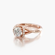 a rose gold ring with an oval diamond in the center