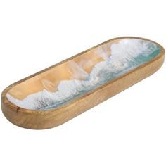 an oval wooden container filled with water and foam