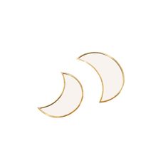 two white and gold crescent shaped earrings on a white background with the moon in the middle