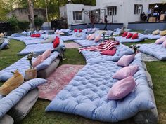 a bunch of mattresses that are in the grass