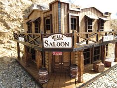 a model of a saloon with barrels on the outside