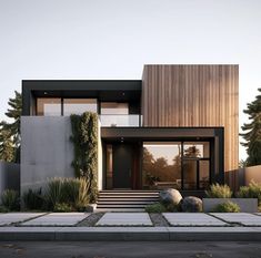 a modern house with an entry way leading to the front door