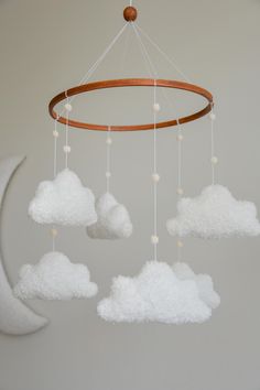 a white cloud mobile hanging from the ceiling