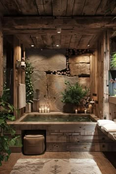 a bathroom with a jacuzzi tub surrounded by greenery and candles on the floor