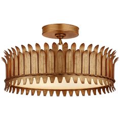 a chandelier that is made out of wood and has spikes on the bottom