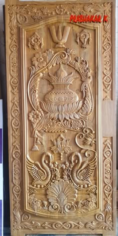 an intricate carved wooden panel on display