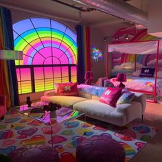 a living room filled with furniture and colorful walls