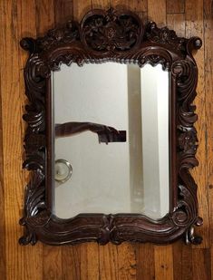 Gorgeous vintage Baroque-style wooden mirror featuring intricate carved details. The mirror measures 28 inches tall by 20 inches wide and is made of solid wood, giving it a high-quality, durable feel. It's a beautifully crafted piece that will bring an elegant and dramatic touch to any room. This stunning mirror is in excellent condition and weighs, reflecting its solid construction and craftsmanship. Perfect for adding a vintage flair to your home decor! Desired House, Fancy Mirror, Fancy Mirrors, Baroque Decor, Wooden Mirror, Baroque Style, Mirror Frame, Vintage Mirror, Baroque Fashion