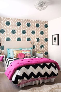 a bedroom decorated in black, white and pink