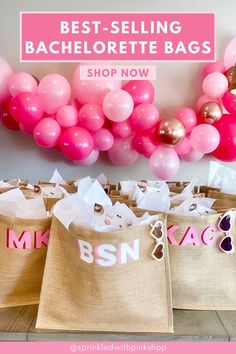 jute carryalls with pink and white balloons on the wall in front of them